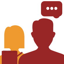 Persona hablando y otra escribiendo